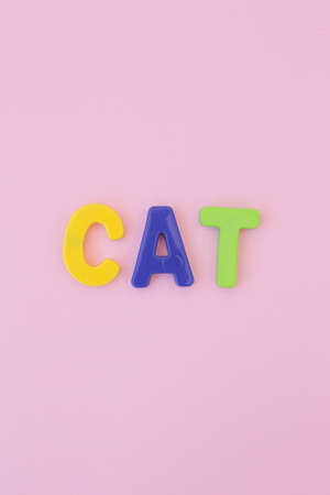 Lots of colored, magnetic letters on a full screen colored background.の写真素材