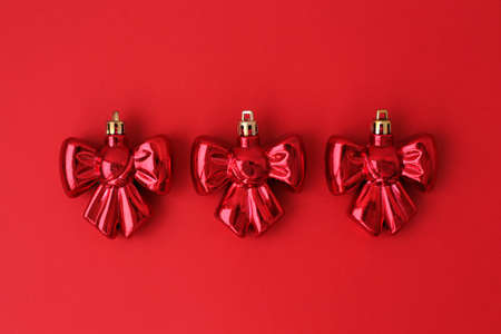 Bright, festive Christmas decorations on a red background in full screen.の写真素材