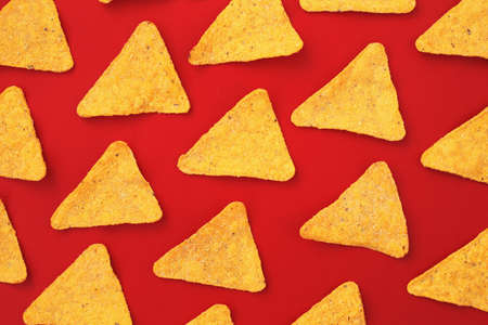 Corn, yellow, salty snacks on a bright, even, light background.