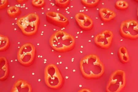 Large slices of red, juicy pepper. They lie on a bright, even background.