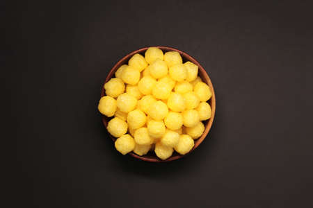 Cheesess balls and snacks, in large amounts of quantities, even backgrounds.