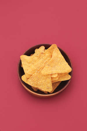 Corn, yellow, salty snacks on a bright, even, light background.の写真素材