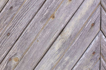 Wooden, old, shabby, colored wall in full screen. Photographed at close range.の写真素材