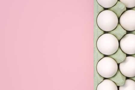 A lot of white chicken eggs on a colorful, even and bright background.の写真素材