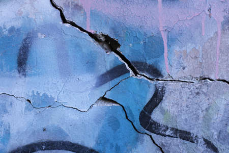 Painting a stray, shabby wall. Photo in full screen.