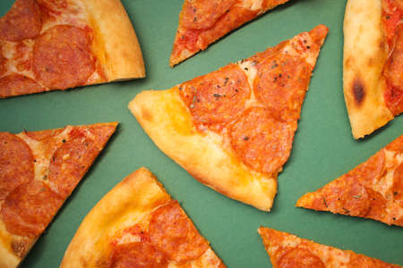 Delicious and fresh pepperoni pizza. Lies on a bright and even background in full screen.の写真素材