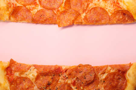 Delicious and fresh pepperoni pizza. Lies on a bright and even background in full screen.の写真素材