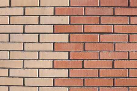 Brick, old, shabby wall in full screen. Wall with bumps and cement.