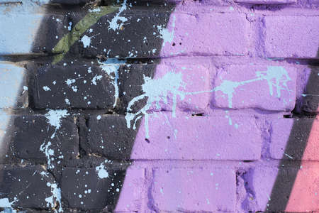 Painted, old, shabby brick wall. Bright and close photo in full screen.の写真素材