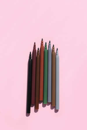 Colored, bright, stylish felt-tip pens on a bright, colored background.