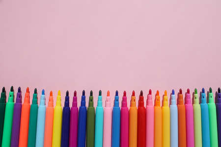 Colored, bright, stylish felt-tip pens on a bright, colored background.