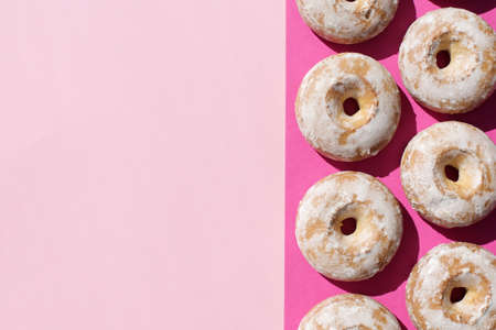 Sweet, delicious, freshly baked donuts on a bright and colorful background.