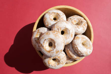 Sweet, delicious, freshly baked donuts on a bright and colorful background.