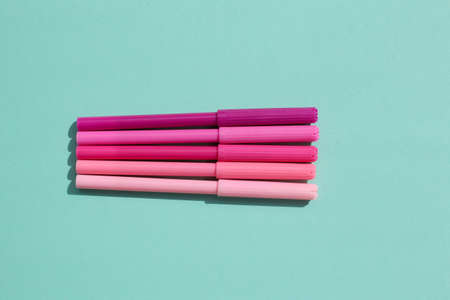 Colored, bright, stylish felt-tip pens on a bright, colored background.の写真素材