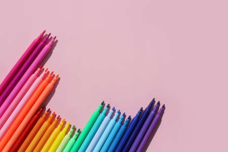 Colored, bright, stylish felt-tip pens on a bright, colored background.