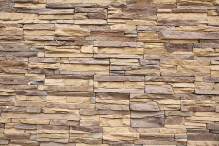 An old, shabby brick wall in full screen. old building.