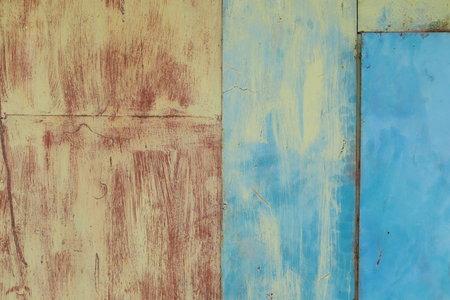 Iron, rusty texture. An old piece of iron, stained paint on the wall.