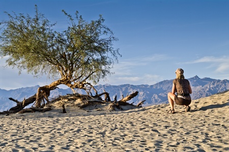 female cowering in the death valley desertの写真素材