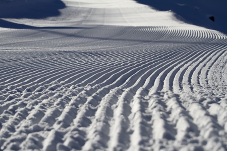 Closeup picture of a prepared slope in a ski areaの写真素材