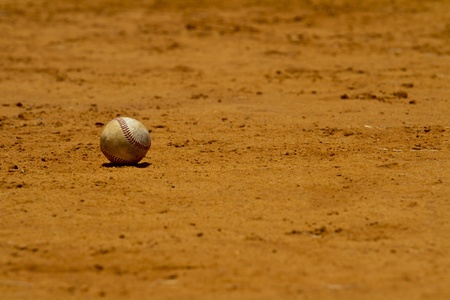 Baseball lies on a playing fieldの写真素材