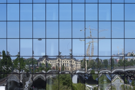 City reflection on the facade of a building
