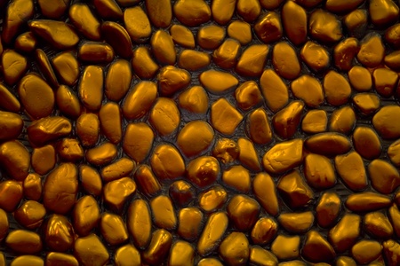 Rocks in a liquid with the shiny appearance of gold.の写真素材