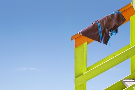 Handrail with trunks of a beach changing roomの写真素材