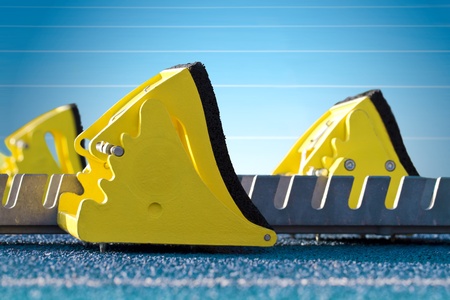 Starting blocks of a blue tartan race trackの写真素材