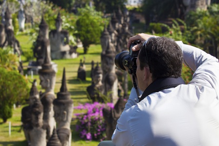 Photographer photographing sculpture park in Asiaの写真素材