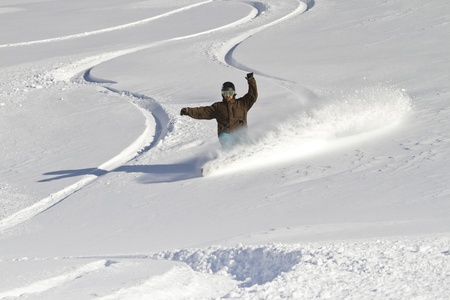 Snowboarder carves backcountryの写真素材