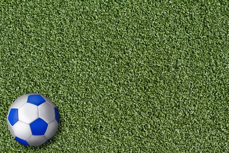 Checked football on artificial grass of a fieldの写真素材