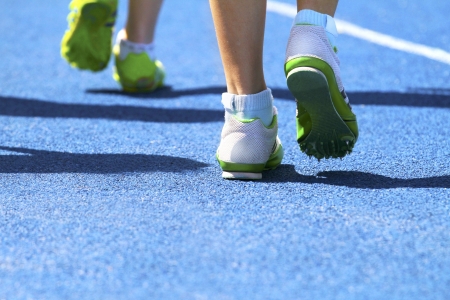 Two sprinters warming up for race competitionの写真素材