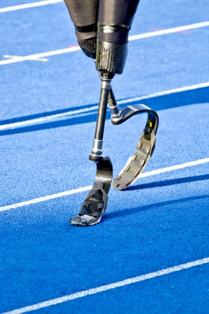 athlete with handicap walks to the start
