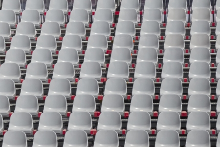 Uniform grey seats in a stadiumの写真素材