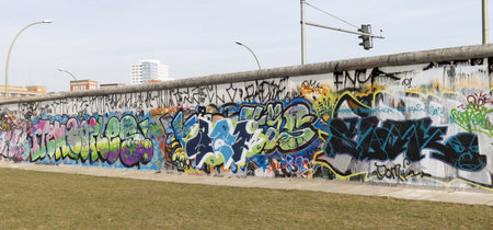 BERLIN - MARCH 06: The East Side Gallery is the largest outdoor art gallery in the world and under the current worldwide  protest in terms of the removal of several  Berlin Wall segments  to allow the construction of a luxury hotel in  MARCH 06, 2013 in Bのeditorial素材