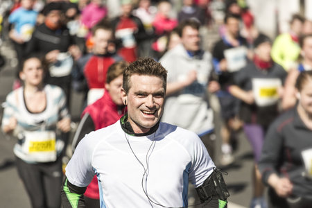 Sportive man in his forties runs a marathonのeditorial素材