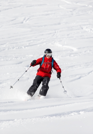 Male with visor helmet is skiing back countryの写真素材