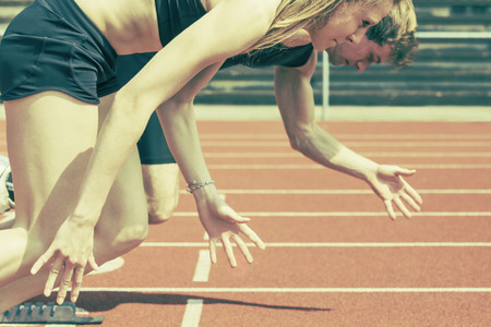 Race of male and female track and field athletes in a stadium  Vintage photo variantの写真素材