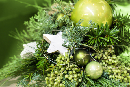 Arrangement of  fir tree branches and green baubles at advent.の写真素材