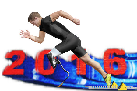 Male athlete starts between motion blurred 2016 date out of the blocks.