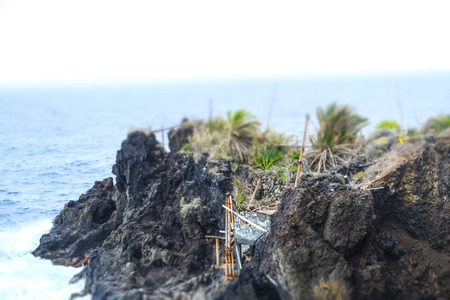 Primitive shack, built in the volcanic rocks of " San Andres de la Palma" bay. Photo with toy camera effect.の写真素材
