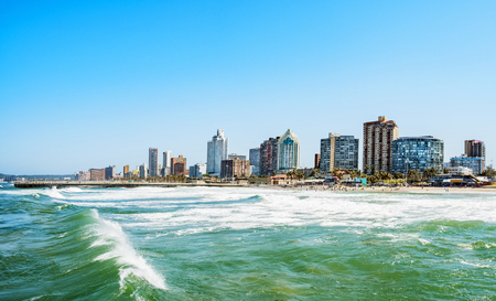 Panorama photo of Durban South Afrika. Big waves crossing the sceneの写真素材