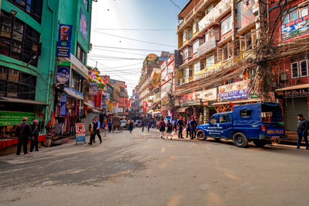 KATHMANDU NEPAL, NOVEMBER 18, 2018 - Crowdy shopping street with police patrol in Thamel, district...