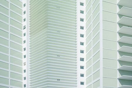 Uniform greenish facade of new buildingの写真素材