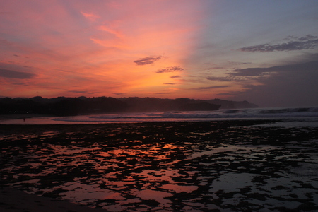 Sunrise at Krakal Beach, Yogyakarta, Indonesiaの写真素材