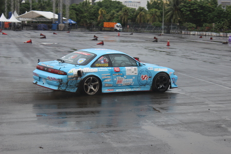 A Blue Nissan Silvia S14 drifting at Achilles Motorsport Festival 2015, Jakarta, Indonesiaのeditorial素材