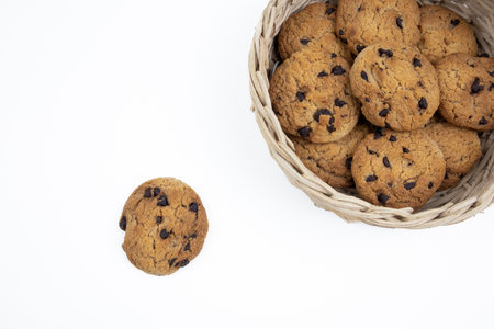 Chocolate chip cookies in a basket isolated on white background with clipping path