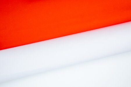 Close up of white and red paper rolls on red and white backgroundの写真素材