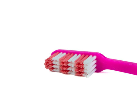 Pink toothbrush on white backgroundの写真素材