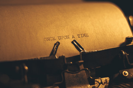 ONCE UPON A TIME typed words on a vintage typewriter. Close up. Antique Typewriter.の写真素材